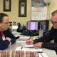 David Ermold, right, files to run for Rowan County Clerk in Kentucky as Clerk Kim Davis watches. (Image via AP)